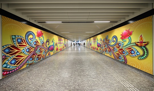 Image of murals along the walls of an MRT station
