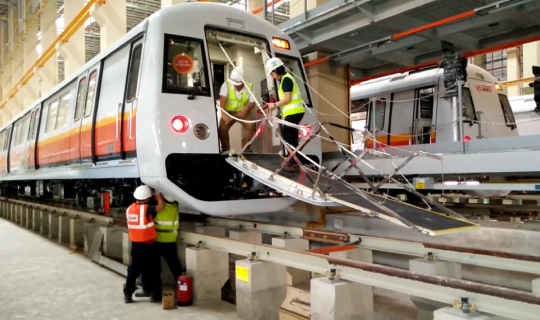 Engineer carrying out maintanence work for train