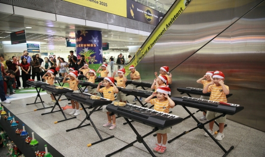 Instrumental performance by NAFA Arts Preschool at Dhoby Ghaut MRT station.
