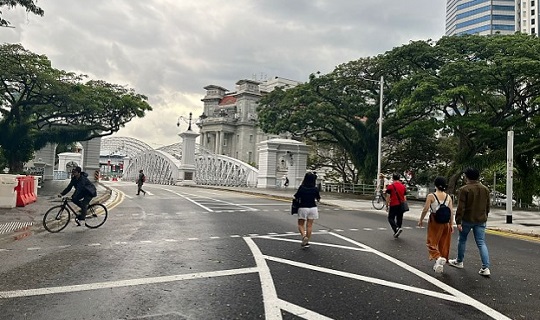 Pedestrians and cyclists enjoying the closure of Fullerton Road/Anderson Bridge during the day Pedestrians and cyclists enjoying the closure of Fullerton Road/Anderson Bridge during the day