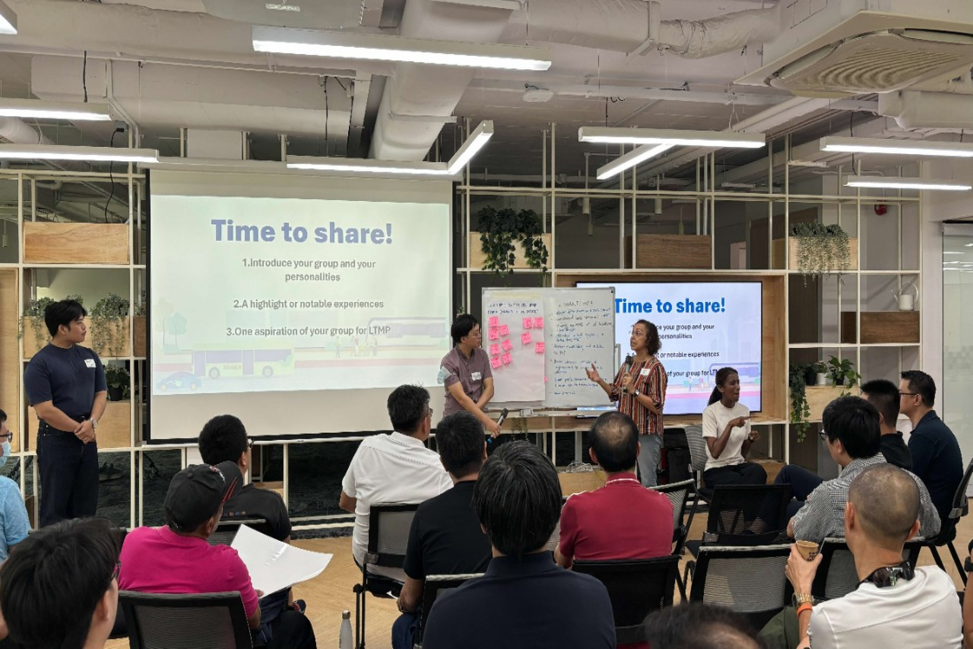 Image of two focus group participants presenting to a crowd