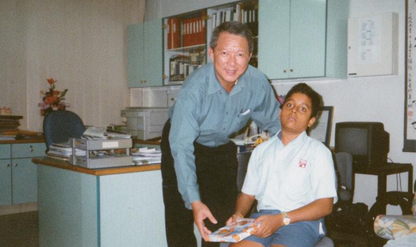 Photo of Dr Navin in Secondary 1, at Si Ling Sec School with his Principal