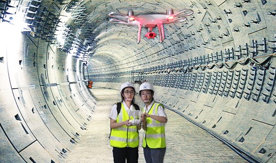 Image of drone task force memebrs with a drone