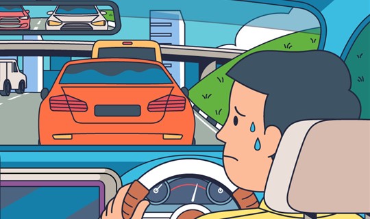 Image of driver waiting in car in a traffic jam