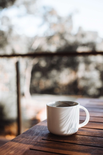 Image of coffee cup on wooden table