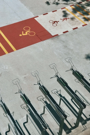 Image of cycling paths with bicycle racks beside it