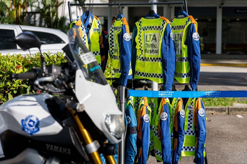 Image of LTA's Traffic Marshal uniforms hung up for display on a rack