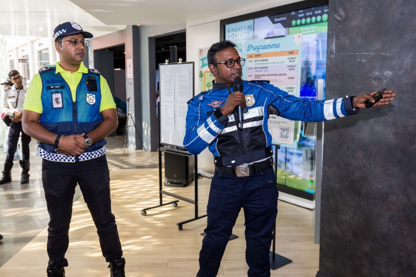 Photo: Featuring our Active Mobility Enforcement Office (AMEO) (left) and Vehicle Enforcement Officer (VEF) sharing more about the work that they do