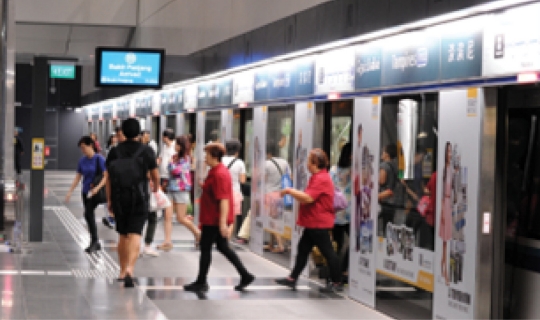 Image of commuters leaving train