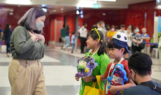 Image of lady with two kids dressed up as Thoughtful Bunch characters